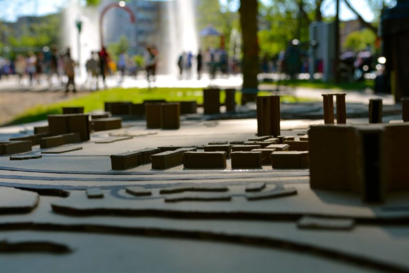 A neighbourhood model in the foreground, and a park in the background