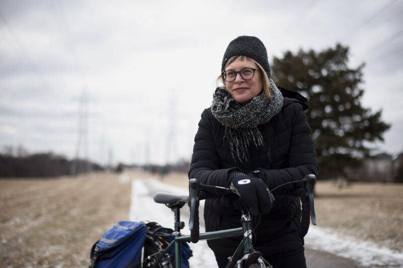 Nancy Smith Lea poses with her bicycle on a hydro corridor path in Willowdale