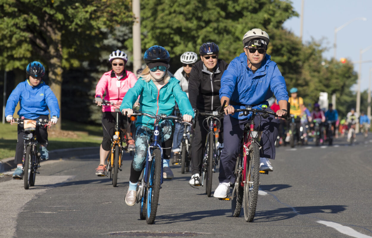 A group of adults and children on bikes in Markham