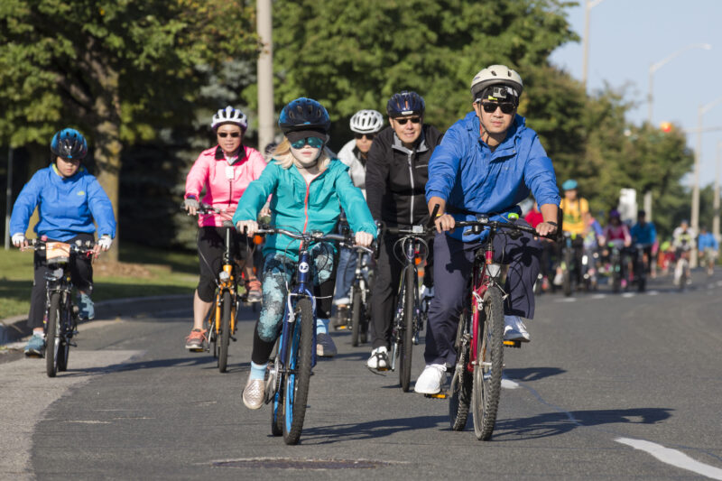 A group of adults and children on bikes in Markham